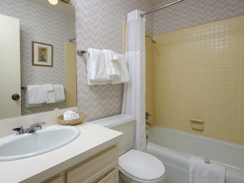 Your private bathroom offers fresh towels, a tub-shower combo, and a bright, welcoming space to refresh after a day exploring the area.
