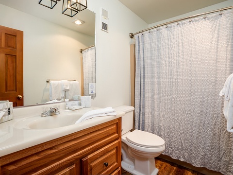 Bright, spotless bathroom with all the essentials you need. Fresh towels await, and the spacious shower offers a refreshing escape after your mountain adventures.