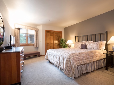 Unwind in your serene bedroom retreat, where soft linens and warm lighting invite peaceful rest after your mountain adventures.