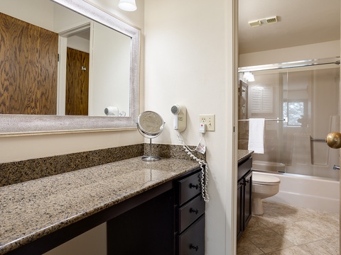 Refresh in your private bathroom with dual vanities, granite counters, and a tub-shower combo—perfect for unwinding after a day of adventure.