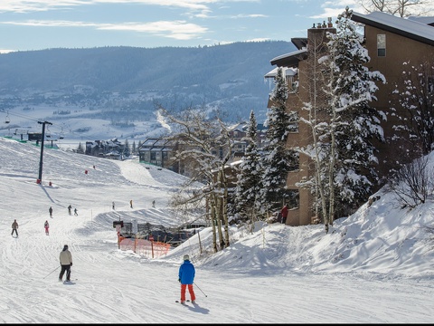 The property sits slopeside in a premier winter destination, offering direct access to pristine ski runs and spectacular mountain scenery throughout your alpine getaway.