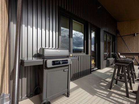 Fire up the grill on your private balcony and enjoy seamless indoor-outdoor entertaining with modern style and mountain air.