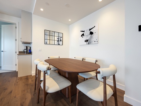 Gather around your sleek dining table for shared meals and conversation in this bright, modern space designed for making memories together.