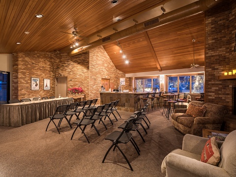 A versatile gathering space combines rustic brick warmth with modern comfort, featuring flexible seating arrangements perfect for your group meetings or celebrations.