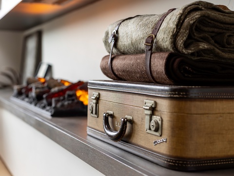 Unpack your bags and settle into your thoughtfully designed space, where warm linens and vintage-inspired touches create a cozy, welcoming retreat.