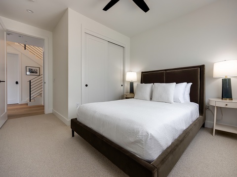 Slip into crisp linens and sink into your plush bed, where vaulted ceilings and soft lamplight create your peaceful retreat after a day exploring the area.
