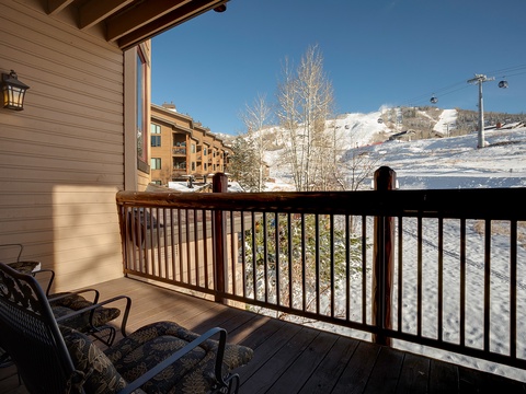 Balcony with direct views of snow-covered slopes and ski lift access—perfect for watching the mountain come alive each morning or unwinding after a day on the slopes.