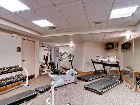 Stay active during your getaway in this well-equipped fitness center featuring treadmills, free weights, and strength training equipment to maintain your wellness routine.