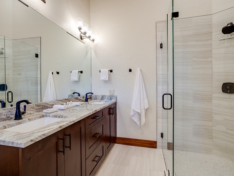 Step into your private spa-like sanctuary with a spacious walk-in shower, dual vanity, and luxurious finishes designed for ultimate comfort and relaxation.