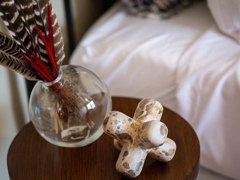 Handpicked decorative touches add warmth and personality to your bedside, making this space feel uniquely yours from the moment you arrive.