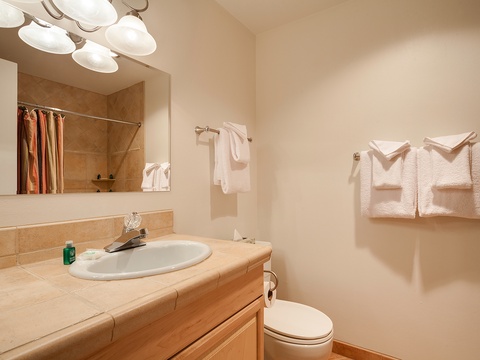 Refresh in your private bathroom with plush towels, a spacious vanity, and a relaxing tub-shower combo for unwinding after your adventures.