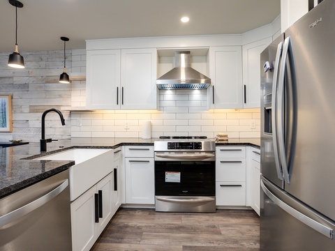 Cook memorable meals in your modern kitchen equipped with stainless steel appliances, granite counters, and ample prep space—perfect for group gatherings or quiet breakfasts.