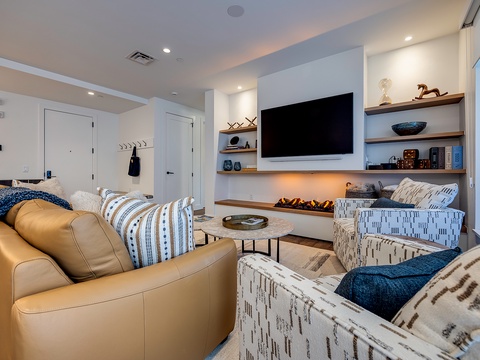 Sink into plush seating and let the warm glow of the fireplace melt away your day. This inviting living space is your perfect retreat after exploring the area.
