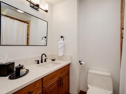 Step into your private bathroom with modern finishes, a spacious vanity, and a relaxing shower—your serene retreat awaits.