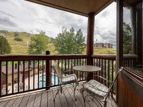 Step out onto your private balcony where mountain breezes and poolside views greet you—perfect for morning coffee or evening relaxation under the open sky.