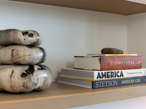 Relax in a stylish space where thoughtful details invite you to unwind—your own curated corner with inspiring reads and artful touches.