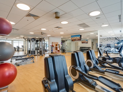 Step into your private fitness haven with state-of-the-art cardio machines, free weights, and exercise balls—everything you need to maintain your routine while away.