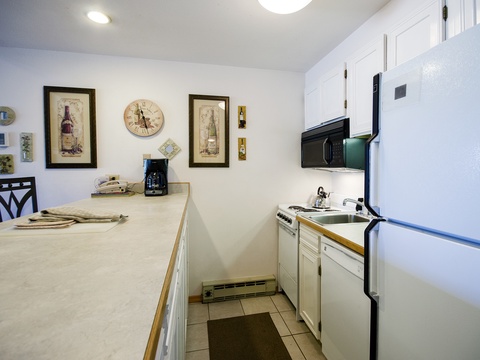 Your fully equipped kitchen features modern appliances, ample counter space, and charming décor—perfect for preparing home-cooked meals or morning coffee during your stay.