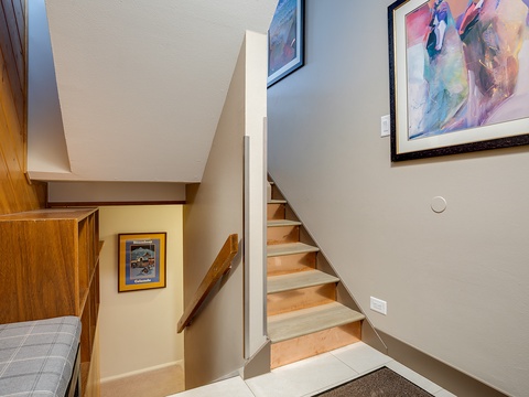 Bright and welcoming multi-level layout with warm wood accents and colorful art that adds character to your mountain retreat.