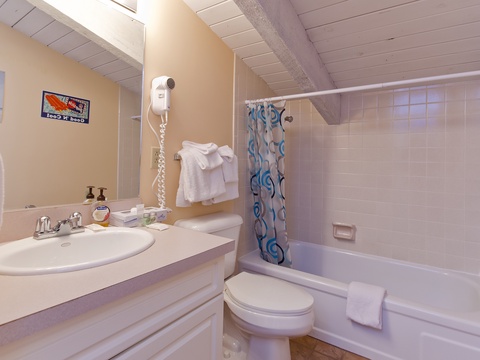 Your private bathroom offers fresh towels, a tub-shower combo, and thoughtful amenities like a hair dryer—everything you need to refresh after a day of adventure.