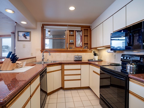 Cook your favorite meals in this fully equipped kitchen featuring ample counter space, modern appliances, and everything you need to feel at home during your mountain getaway.