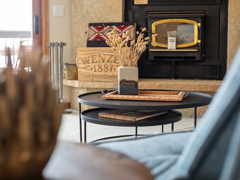 Settle in by the cozy fireplace, where rustic charm meets modern comfort—your perfect retreat for unwinding after a day of exploring.