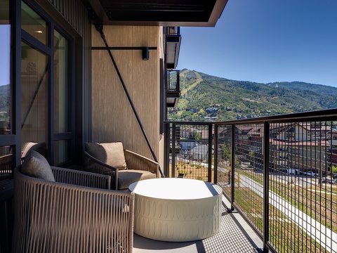 Step onto your private balcony and take in the stunning mountain views. Comfortable seating invites you to relax with morning coffee or unwind as the sun sets behind the peaks.