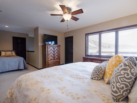 Sink into plush bedding and wake to peaceful views in this spacious retreat, where gentle ceiling fans and thoughtful details promise your most restful nights.