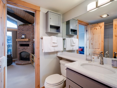 Freshen up in your private bathroom with soft towels and a cozy fireplace view. Everything you need for a relaxing mountain retreat is right at your fingertips.