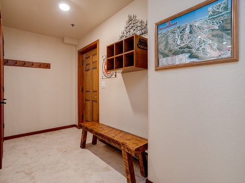 Arrive to a welcoming entryway with convenient storage and ski trail map—your perfect basecamp for mountain adventures awaits.