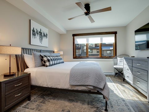 Slip into crisp linens and let the ceiling fan cool you after a day of adventure. Your restful retreat awaits with soft lighting, tasteful decor, and mountain village views just outside your window.