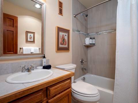 Your private bathroom features a convenient tub-shower combo, fresh towels at the ready, and thoughtful amenities to help you unwind after a day of adventure.