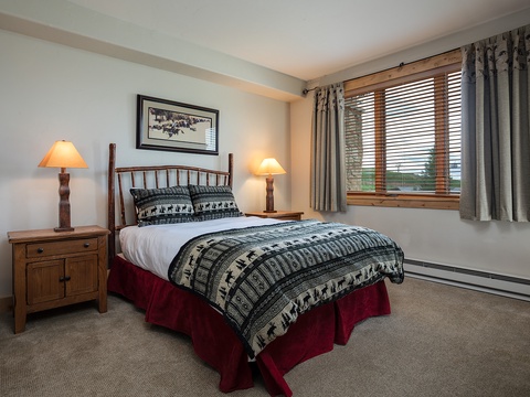 Settle into your cozy bedroom with rustic charm. Soft bedding and warm lighting create a peaceful retreat after a day of adventure.
