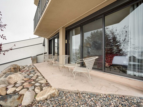 Your private balcony awaits, offering a serene outdoor retreat with charming seating where you can unwind and enjoy the peaceful surroundings at any time of day.