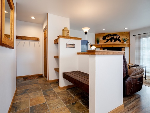Step inside to warm wood accents and a spacious, welcoming layout. You'll find rustic charm paired with cozy comfort—perfect for unwinding after your mountain adventures.