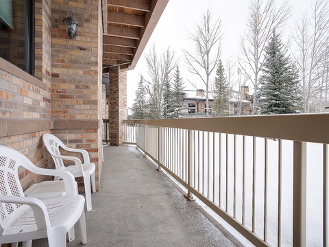 A private balcony where you can breathe in crisp winter air, admire snow-dusted evergreens, and enjoy peaceful mountain views from your own outdoor seating area.