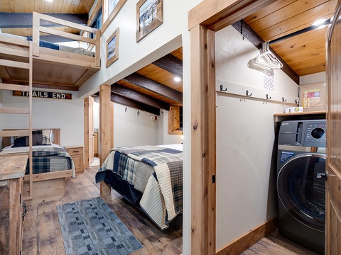 Step into your cozy mountain retreat with rustic wood beams, comfortable bunk beds for the whole crew, and convenient in-unit laundry to keep your adventure going strong.