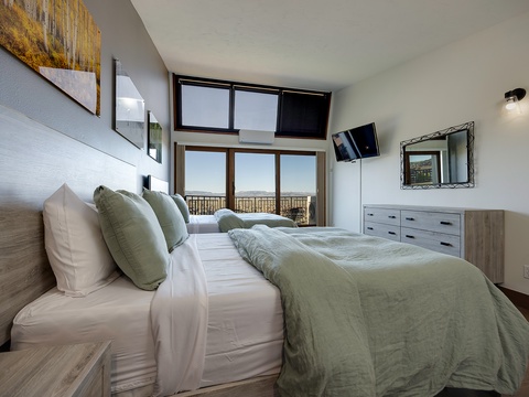 Wake up to sweeping views framed by floor-to-ceiling windows that flood your peaceful retreat with natural light and connect you to the landscape beyond.