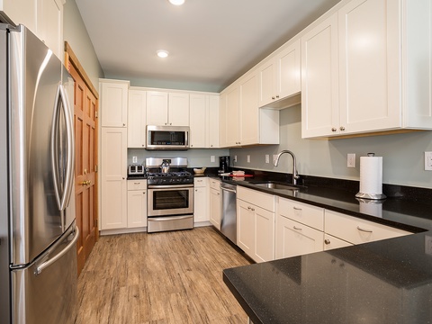 Your modern kitchen awaits with sleek stainless appliances, ample counter space, and everything you need to whip up favorite meals or quick snacks during your stay.