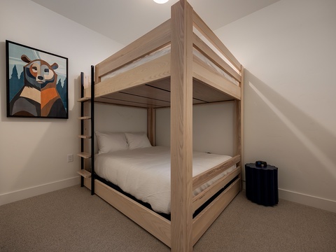 Your kids will love this cozy room with its sturdy bunk beds and playful bear art—perfect for bedtime stories and sweet dreams after a day of adventure.