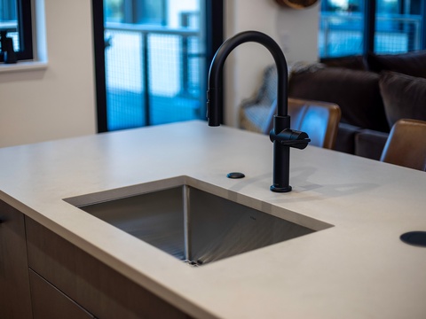 Sleek modern kitchen with stylish matte black fixtures and plenty of counter space for your cooking adventures.