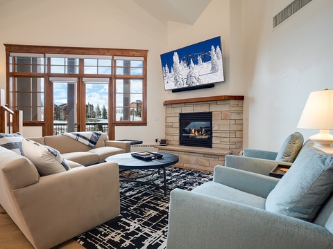Sink into plush seating by your private fireplace while gazing at mountain views through expansive windows—your perfect après-ski sanctuary awaits.