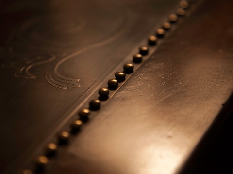 The property features distinctive architectural details including decorative rivets and metalwork that reflect the building's character and craftsmanship.