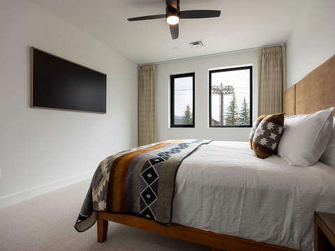 Sink into plush linens and wake to peaceful mountain views framing your window. Your private retreat awaits with thoughtful touches and natural light.