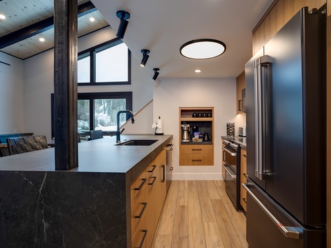 Your culinary haven features sleek countertops, premium appliances, and a thoughtfully designed coffee station—perfect for starting mornings your way and preparing memorable meals.