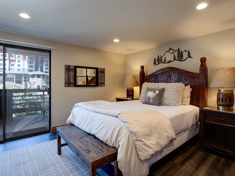Unwind in your peaceful bedroom with rustic mountain charm, plush bedding, and warm wood tones. Your private balcony invites fresh air and natural light, creating the perfect retreat.