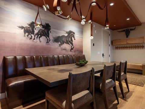 Gather around this inviting dining space where rustic elegance meets modern comfort. Rich leather seating and warm wood tones create the perfect setting for your memorable meals together.