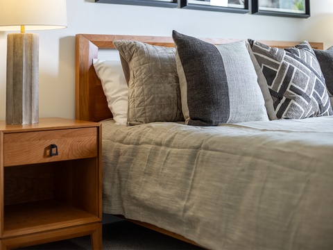 Sink into plush linens and designer pillows after a day of exploring. Your restful retreat awaits with thoughtful details and warm, modern touches.