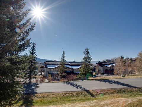 Scenic mountain property surrounded by evergreens and open spaces, offering a peaceful retreat with nearby trails and natural beauty.