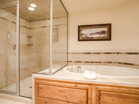 Unwind in your elegant ensuite with a deep soaking tub and spacious walk-in shower, both finished with beautiful tile work perfect for pure relaxation.